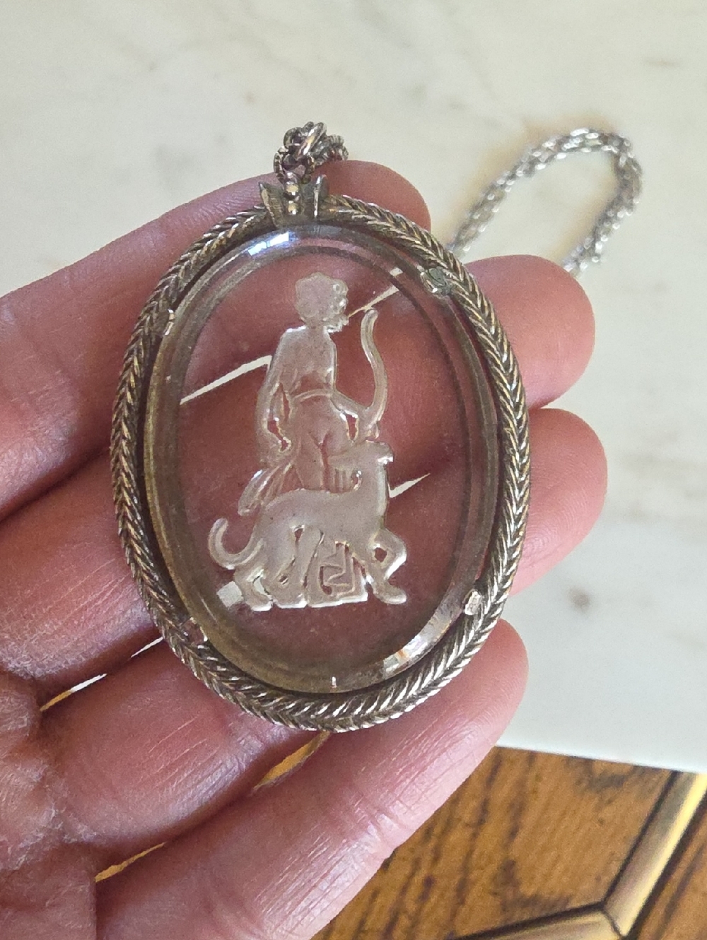 1973 Avon "Diana the Huntress" silver-tone reverse intaglio glass pendant